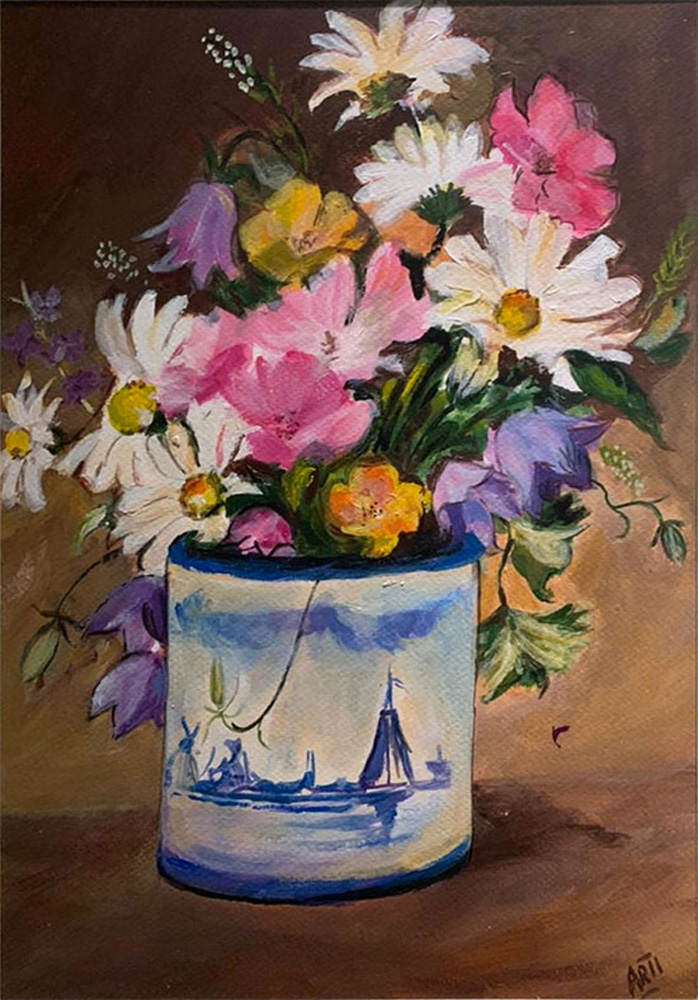 Assorted Flowers in Blue Pottery Mug